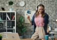 Audio + Radio: Girl with Earphones (dancing) © unsplash.com/Vitaly Gariev