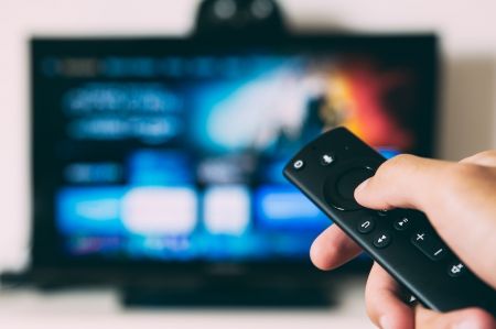 Television with Remote Control © unsplash.com/Glenn Carstens-Peters