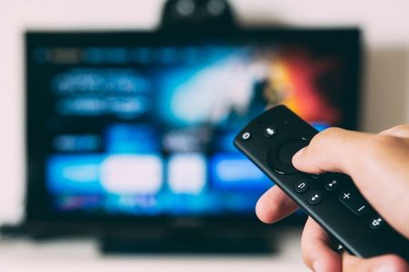 Television with Remote Control © unsplash.com/Glenn Carstens-Peters